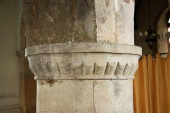 Scalloped capital